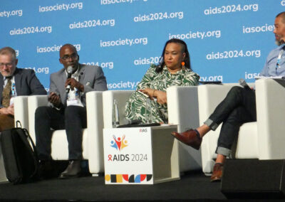 Four people present on a panel at the 2024 AIDS Conference.