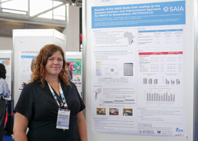 Kristjana Asbjornsdottir presents a poster at the 2024 AIDS Conference.